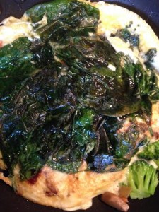 Flipped frittata with spinach now on the top.