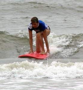 Linda Powers surfing at the Women's Surf Camp in Ocean City, MD